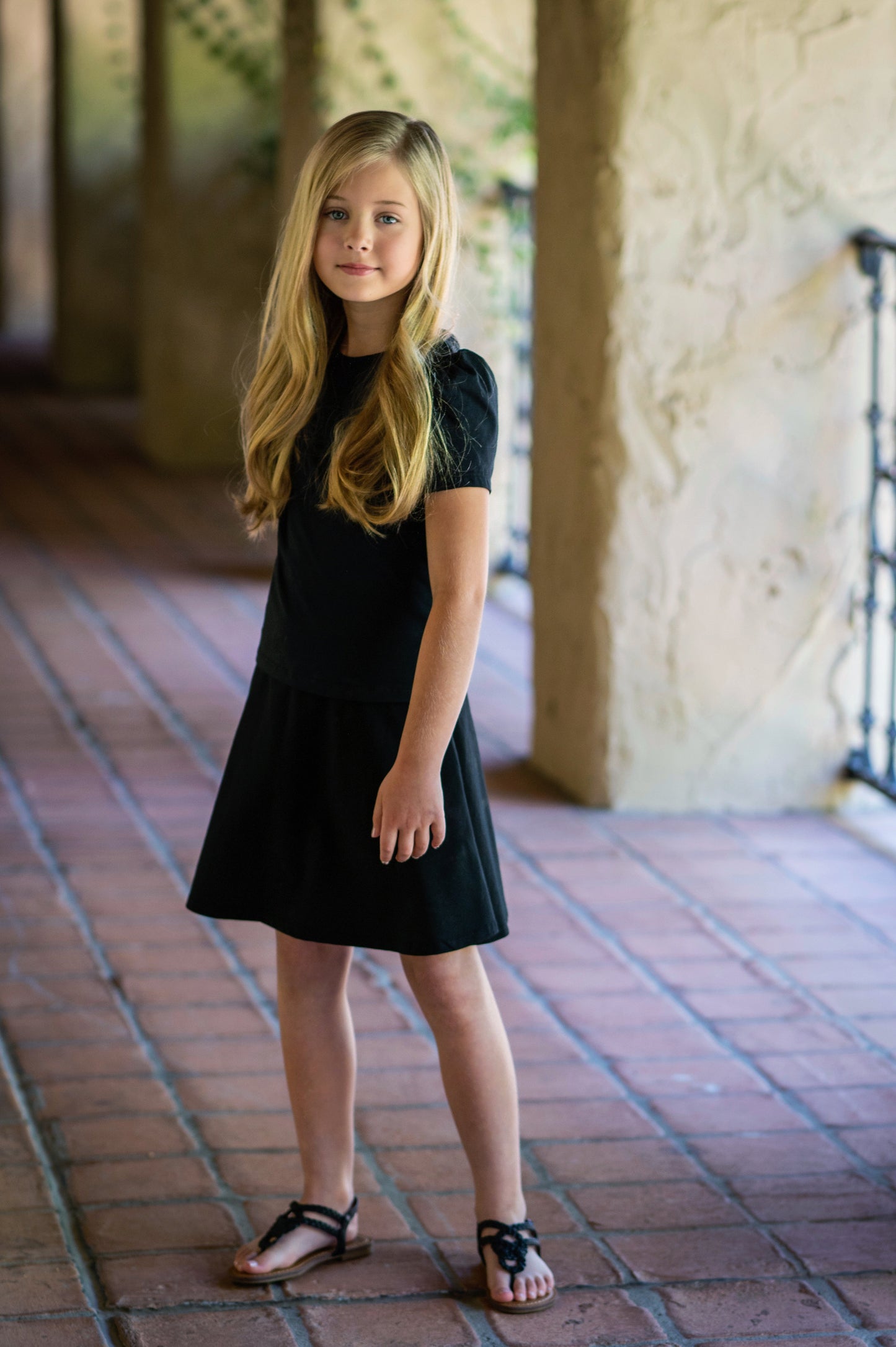 Girl wearing our back short sleeve t-shirt